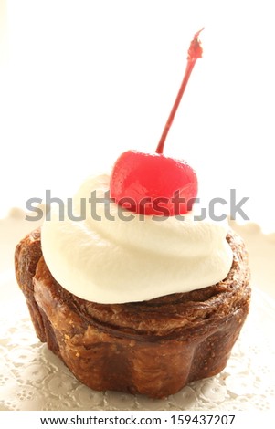 close up of Homemade cupcake with cherry on top
