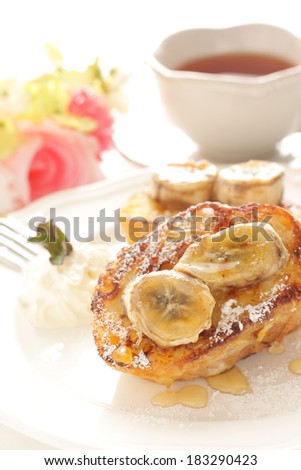 Pan fried banana on honey french toast and english tea for gourmet breakfast image