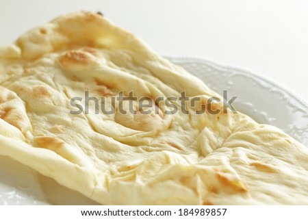Indian food, Naan on white background with copy space