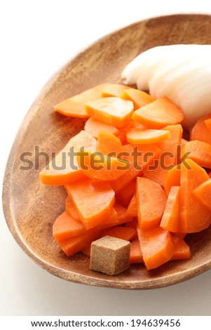 sliced carrot and onion with instant Bouillon cube for soup instant image