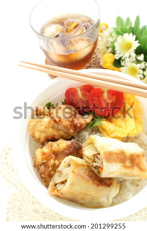 Japanese food, chinese dish and rice in packed lunch Obento