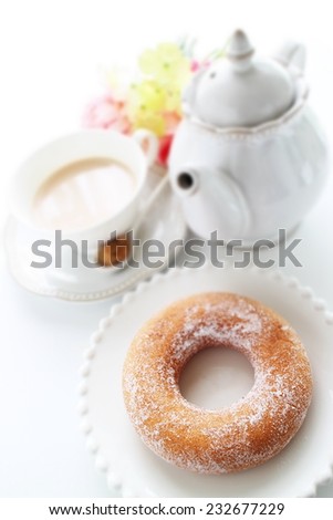 sugar donut and milk tea on white background