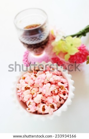 Snack food, pink strawberry pop corn  and cola drink