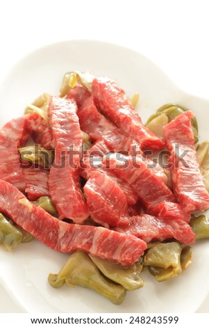 Chinese cooking, prepared marble beef and pickled vegetable on white dish ready for steaming
