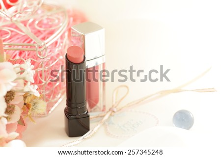 lipstick and flower for cosmetic image