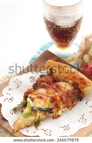 Cheese and beef pizza with cola drink