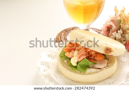 Salmon and English muffin Sandwich with iced tea