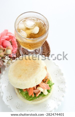Salmon and English muffin Sandwich with iced tea