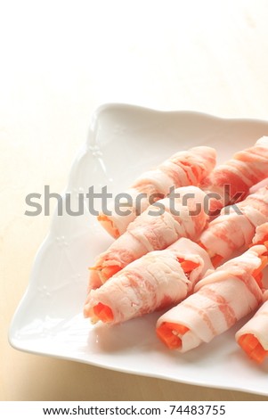 Cooking of fusion food, bacon roll with carrot and cheese