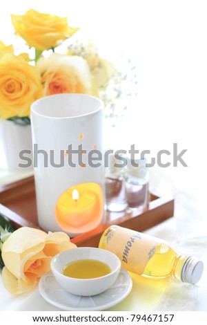 Aroma oil and massage oil with yellow rose for beauty salon image