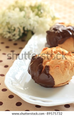 French confectionery, chocolate coating Eclair on dot cloth