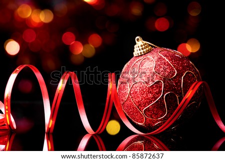 New year,christmas toy and decorative ribbon on abstract shine background