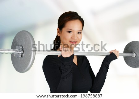 Woman working out while at the gym