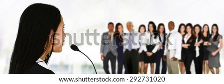 Woman giving a speech at a convention
