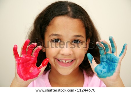 Girl at school finger painting