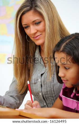 Teacher and Student In A Classroom At School