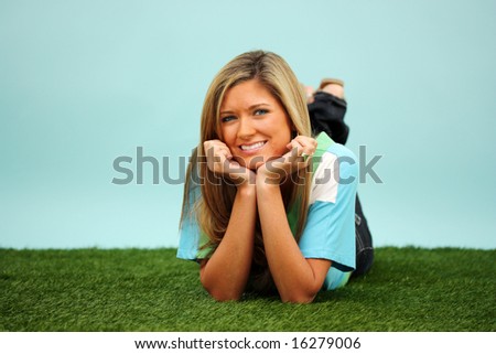 Woman Laying Down Outside In The Grass