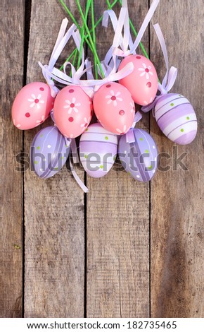 Pink Plastic Easter Egg over wooden or timber background