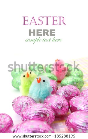 Easter chocolate eggs with little Easter chicken isolated on white