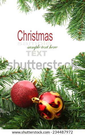 Background with copy space: Christmas decoration (branch of spruce tree,  red bubbles) on the white background