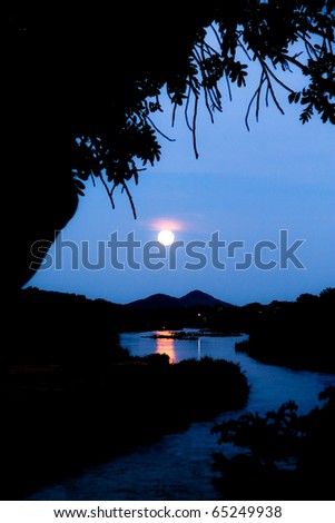 Full Moon Rising over the mountains behind the Crocodile River in the Kruger National Park