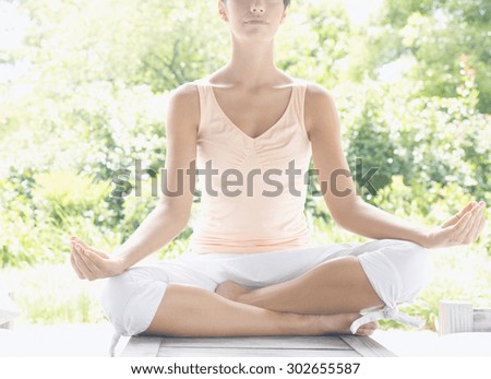 Young healthy woman practicing yoga outdoor