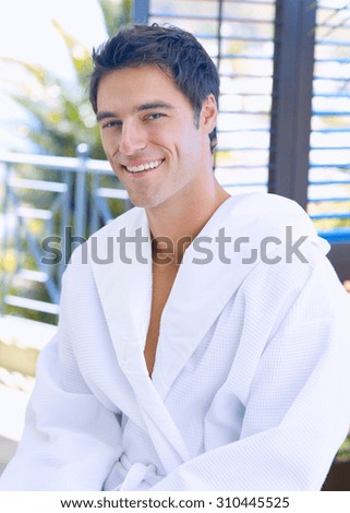 Adult man in bathrobe