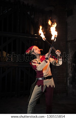 Street Performer Jester with Torch