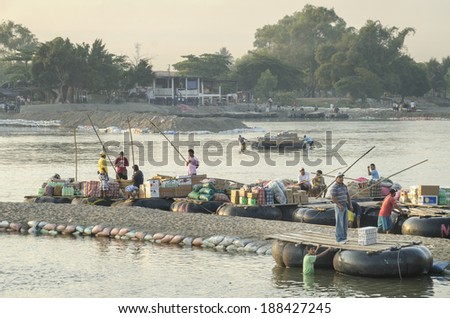 CHIAPAS, MEXICO- FEBRUARY 25:In the Mexican south border goods and general produce are carried by means of big inflated tires instead of proper boats. Photo taken from Mexico on February 25, 2011