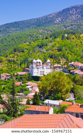 Mountain Village Pedoulas, Cyprus.  View over  roofs of houses, mountains and Big church of Holy Cross. Village is one of most picturesque villages of Troodos mountain range