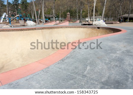 Close up detail of an empty skate park bowl ramp.