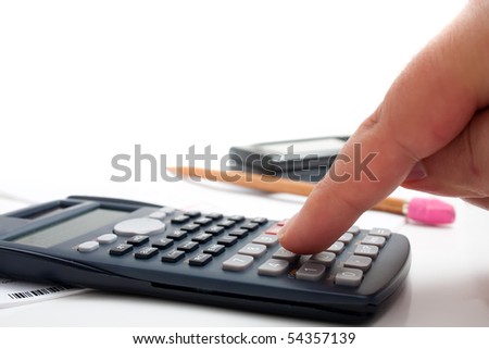 A finger adding up figures using a calculator isolated over a white background.