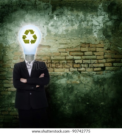 Businessman idea  head bulb symbol with recycled icon on break wall