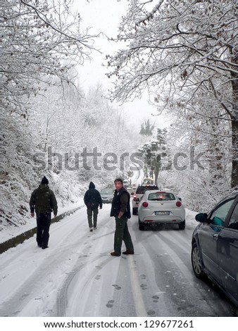 MONTRIGIASCO - FEB 24:Cars wait for road to be opened by a snowplow, heavy snow in winter time cause transportation problem to the villages on February 24, 2013 in Montrigiasco di Arona, Italy