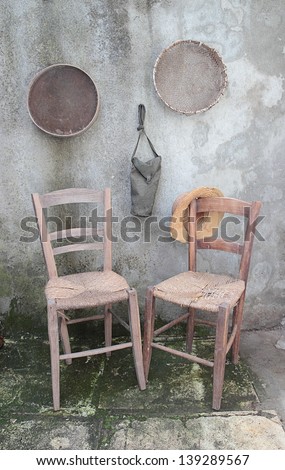 shabby interior with wooden chairs