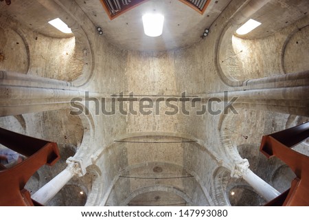 SAN LEO, ITALY - JULY 20: Romanesque interior of the Cathedral built in VII century in a fish-angle view on July 20, 2013 in San Leo, Italy