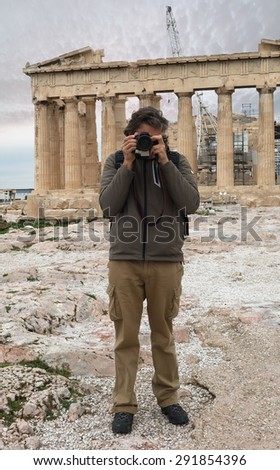photographer under the Parthenon ancient temple on the Athenian Acropolis