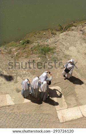 ROME, ITALY - MAY 22, 2015: group of Catholic  sisters, who rarely leave their convents, take a picture along river Tiber