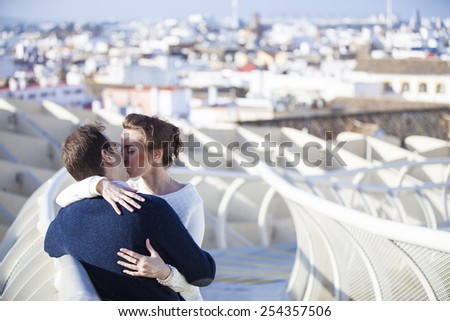 Two people enjoying the time spending with each other. Metropol Parasol detail in Seville, Spain