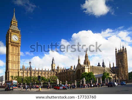 Big Ben, Westminster Palace, London. Wide angle view with london bus and taxis.