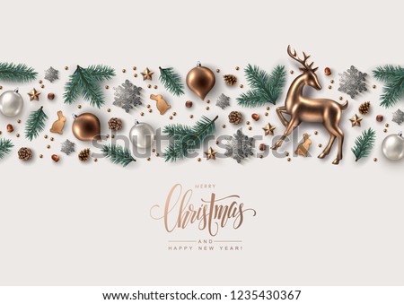 Decorative Horizontal Border made of Christmas Ornaments, Pine Branches, Snowflakes, Cookies and Gold Glass Reindeer.  Flat lay, top view.