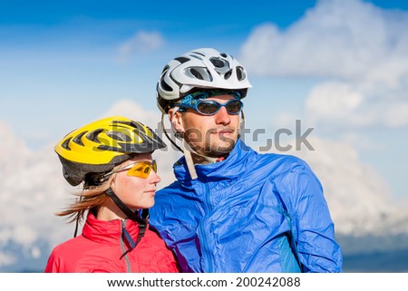 Happy carefree mountain bike couple portrait