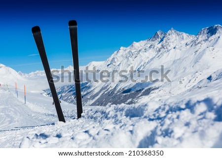 Ski, winter sport, winter mountains - ski run in Swiss Alps