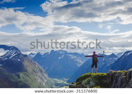 Hiker on the mountain top. Sport and active life concept