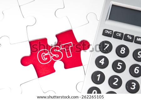 Goods and Services Tax (GST) alphabet with puzzle and calculator