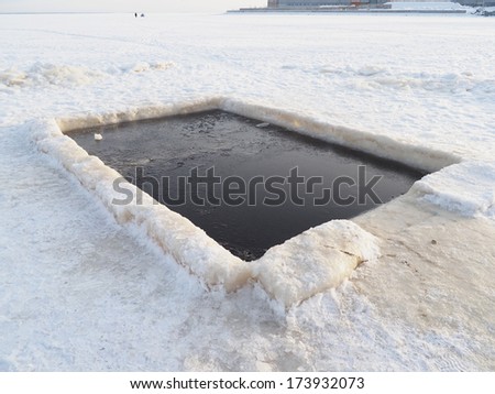 hole on the lake in winter