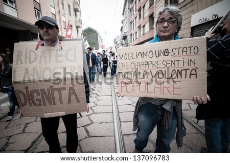 MILAN, ITALY - MAY 1: labor day held in Milan on May 1, 2013. Every year thousands of people taking to the streets to celebrate labor day and to protest against italian austerity