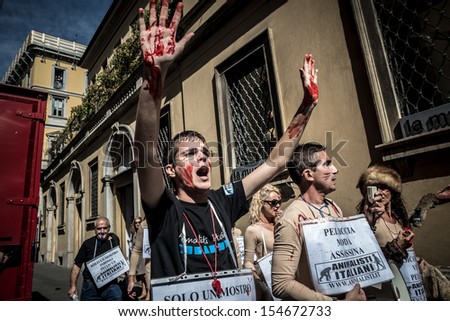 MILAN, ITALY - SEPTEMBER 17: Animalisti Italiani protest on September 17, 2013. Animal right association 'Animalisti Italiani' protest against furs and fashion, in famous Milan street Monte Napoleone