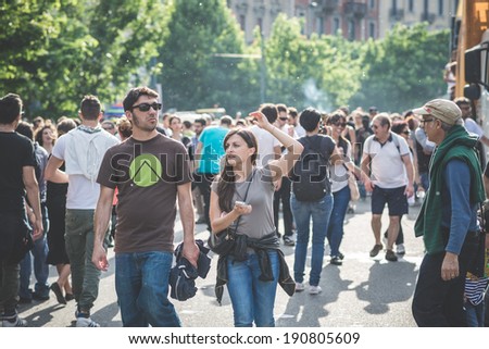 MILAN, ITALY - MAY 1: labor day held in Milan on May 1, 2014. Every year thousands of people taking to the streets to celebrate labor day and to protest against italian austerity