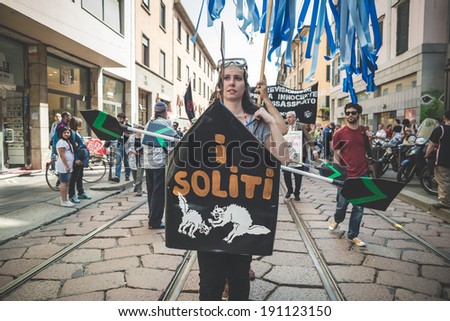 MILAN, ITALY - MAY 1: labor day held in Milan on May 1, 2014. Every year thousands of people taking to the streets to celebrate labor day and to protest against italian austerity